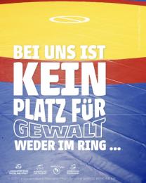"Kein Platz für Gewalt. Weder im Ring..." auf Foto einer blau-rot-gelben Ringermatte
