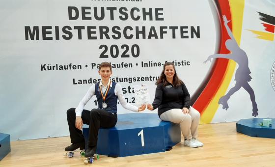 Sportler mit Trainerin